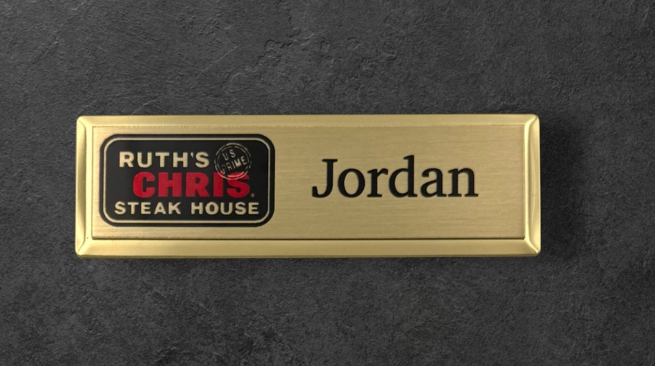 Gold name tag with 'Ruth's Chris Steak House' logo and 'Jordan' text on a gold background