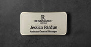Silver Renaissance Hotels name tag with logo and text