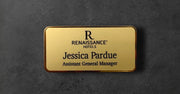 Gold name tag with 'Renaissance Hotels' logo and text 