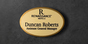 Gold Oval name tag with 'Renaissance Hotels' logo and text 
