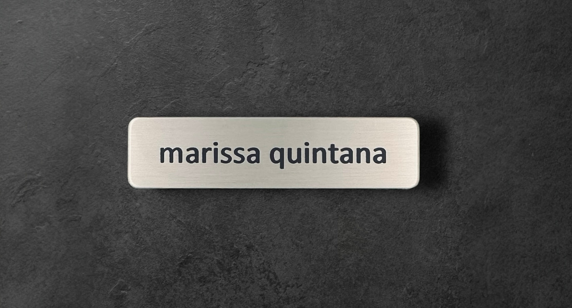 Silver nickel 5/8″ x 2 1/2″ name tag with name and title or name only. Simple yet stylish.